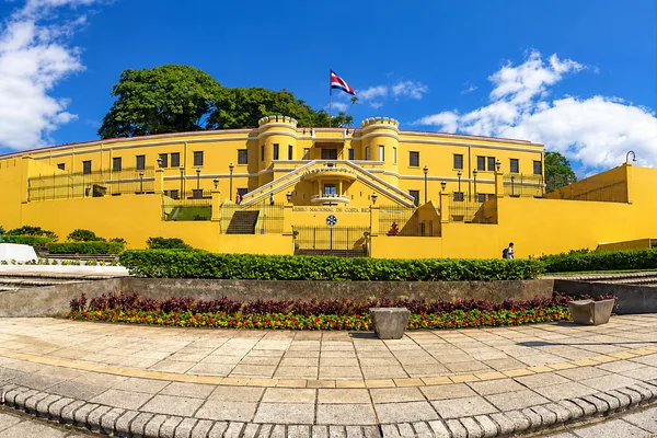 Yellow former fortress building with turrets housing the National Museum of Costa Rica in San Jose