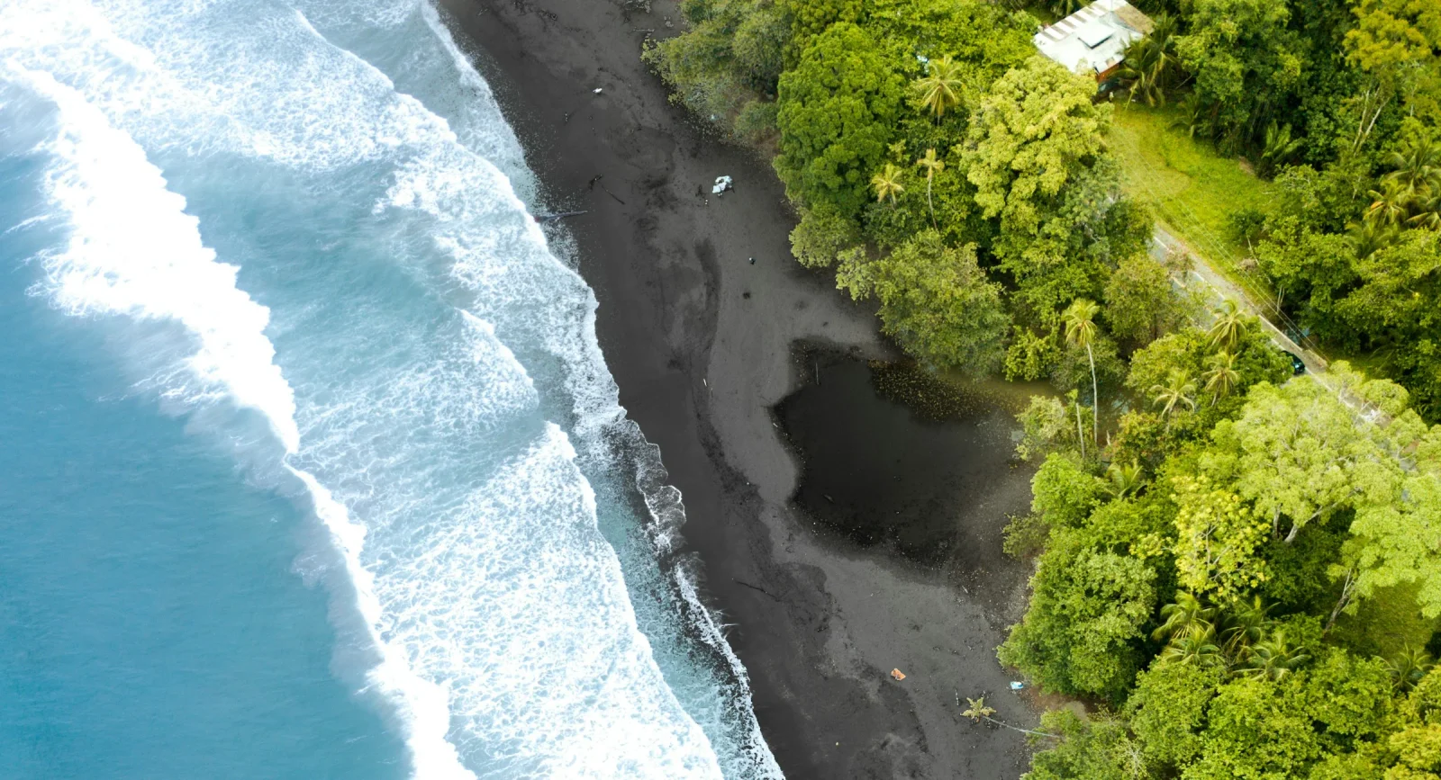 Aerial view of the beach, jungle and turquoise Caribbean water at Puerto Viejo de Talamanca, Costa Rica