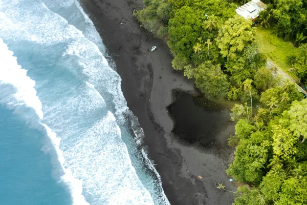 Aerial view of the beach, jungle and turquoise Caribbean water at Puerto Viejo de Talamanca, Costa Rica